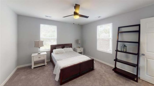 carpeted bedroom with ceiling fan