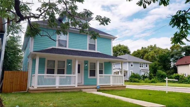 view of front of property featuring a porch and a front lawn