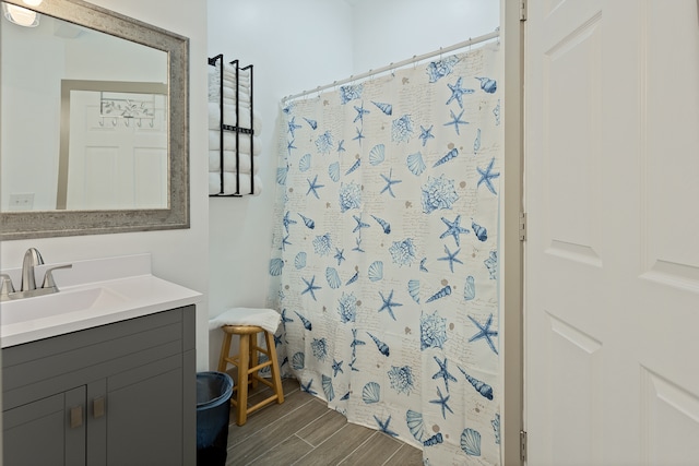 bathroom featuring vanity and hardwood / wood-style floors