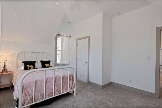 bedroom featuring light carpet, lofted ceiling, and ceiling fan