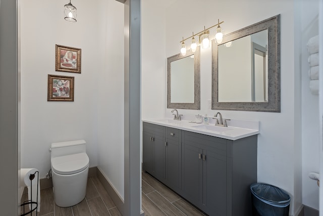 bathroom featuring tile flooring, double sink vanity, and toilet