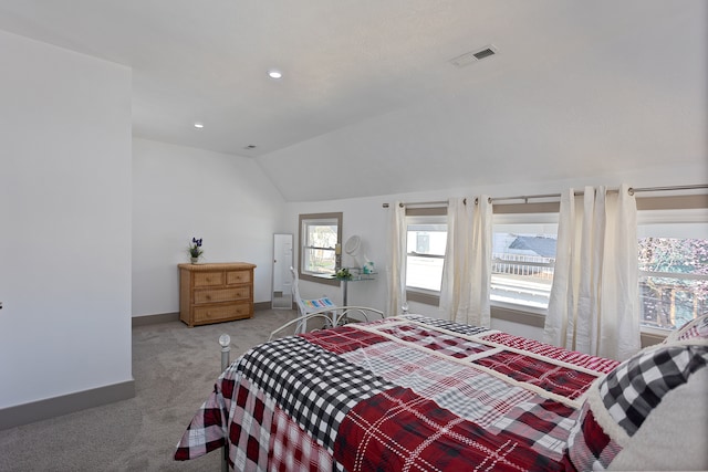 bedroom featuring lofted ceiling and dark colored carpet