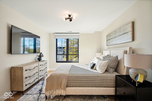 bedroom featuring dark wood-type flooring