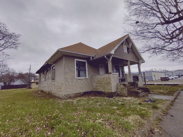 view of property exterior featuring a lawn