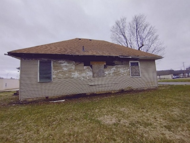 view of property exterior featuring a lawn