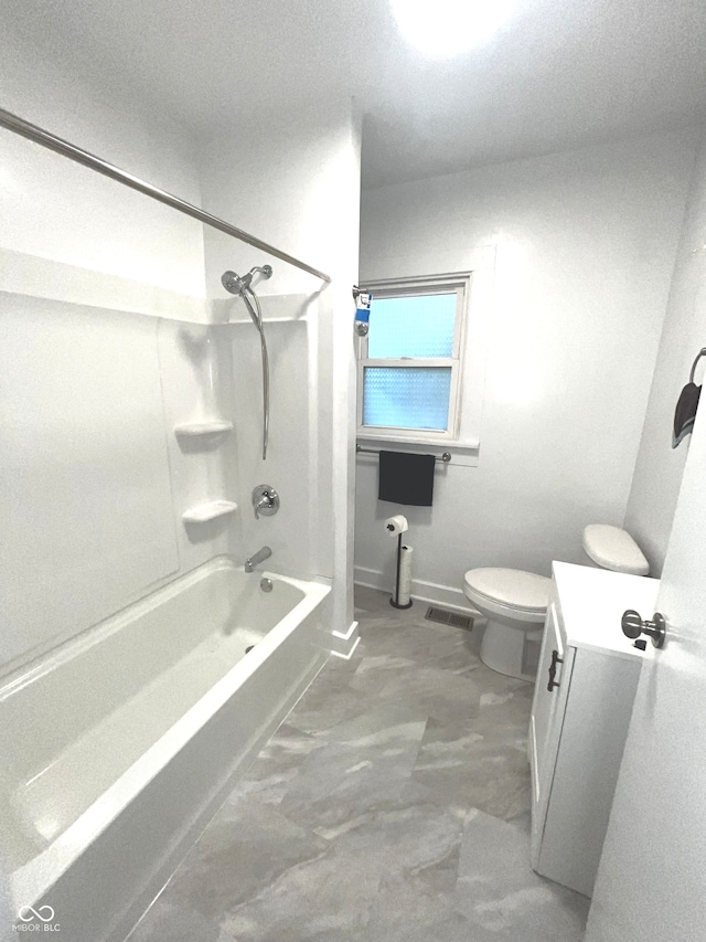 bathroom with shower / washtub combination and toilet