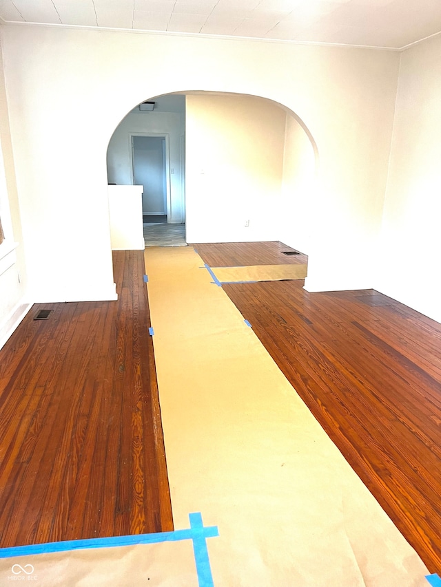 unfurnished room with hardwood / wood-style floors