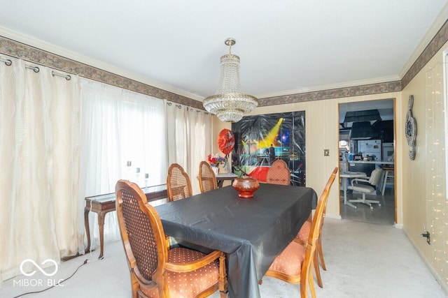 carpeted dining room with a notable chandelier and ornamental molding