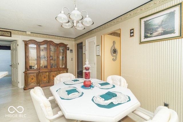 dining space featuring a chandelier