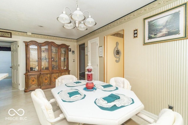1205 Ivywood Ct, New Castle, IN 47362 - dining space with wallpapered walls and a notable chandelier