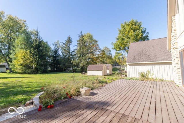 1205 Ivywood Ct, New Castle, IN 47362 - wooden terrace with a lawn, an outbuilding, and a storage shed