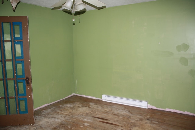 unfurnished room featuring ceiling fan, hardwood / wood-style flooring, a textured ceiling, and baseboard heating