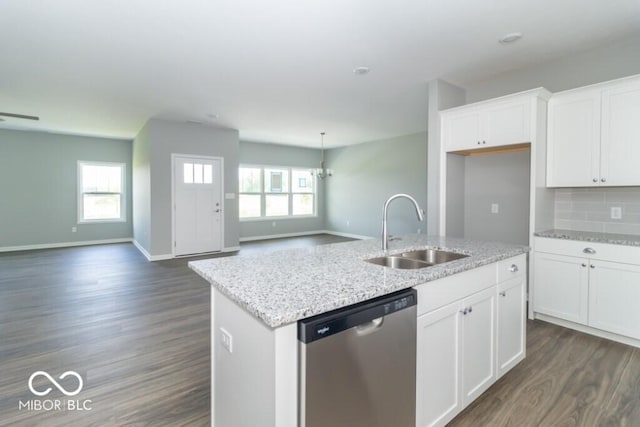 kitchen with dishwasher, sink, an island with sink, decorative backsplash, and white cabinets