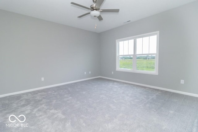 unfurnished room featuring carpet and ceiling fan