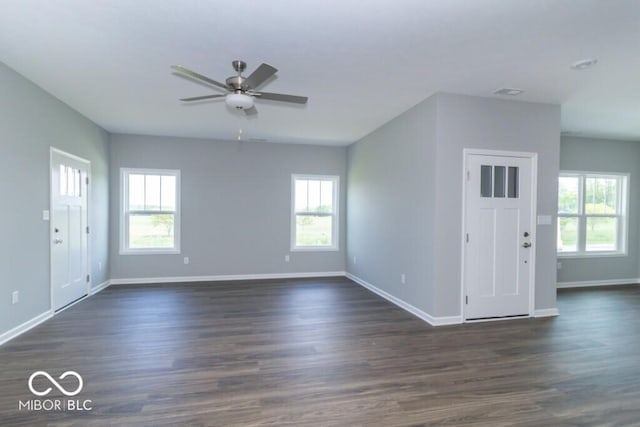 entryway with ceiling fan and dark wood-type flooring