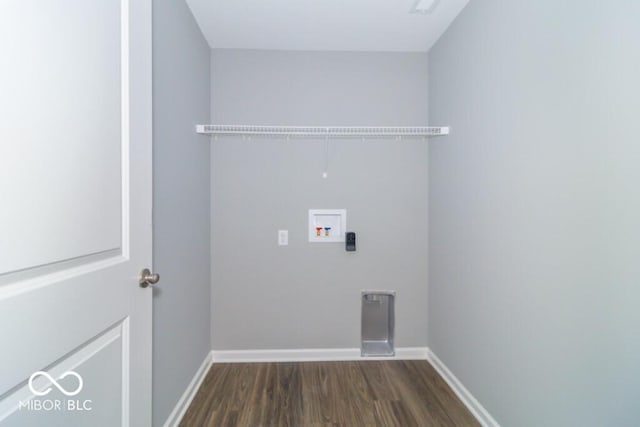 laundry room with hookup for a washing machine and dark wood-type flooring