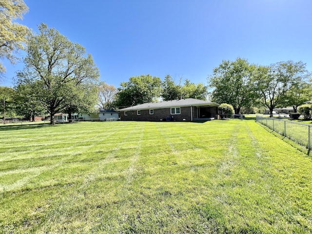 view of yard with fence