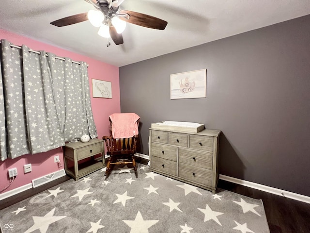 sitting room with baseboards, ceiling fan, and visible vents