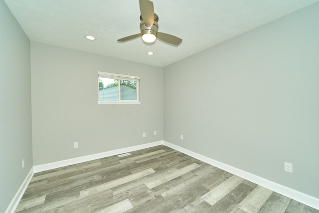 empty room featuring ceiling fan and light wood-type flooring