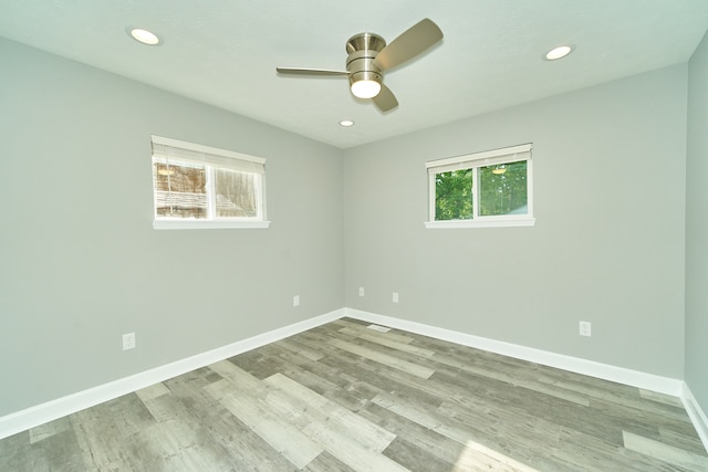 empty room featuring light hardwood / wood-style floors and ceiling fan