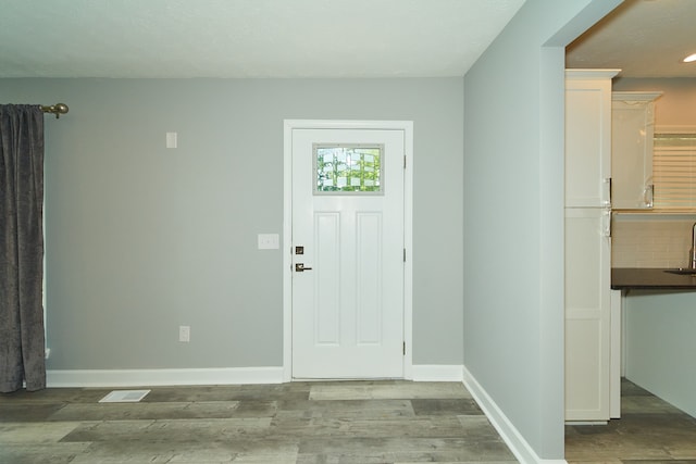 foyer with dark wood-type flooring