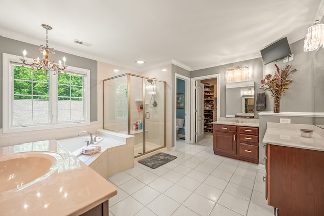 bathroom with tile flooring, independent shower and bath, vanity, and a notable chandelier