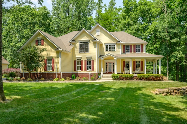 view of front facade with a porch and a front lawn