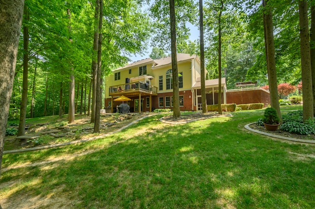 rear view of property with a yard