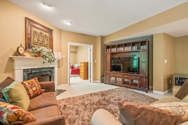 carpeted living room featuring a fireplace