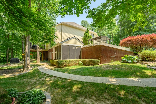 view of yard with a sunroom