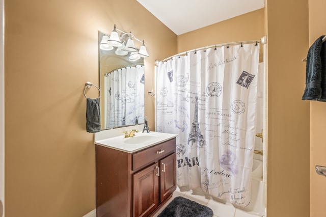 bathroom with shower / bath combo with shower curtain and vanity with extensive cabinet space