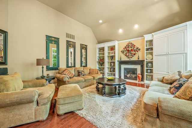 living room featuring light hardwood / wood-style floors and high vaulted ceiling