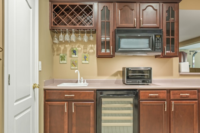 bar with sink and wine cooler