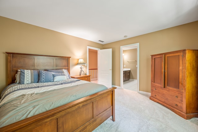 carpeted bedroom with ensuite bathroom