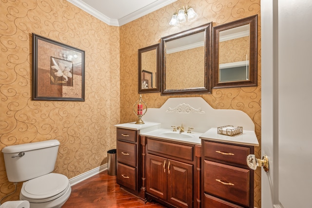 bathroom with crown molding, toilet, hardwood / wood-style floors, and vanity