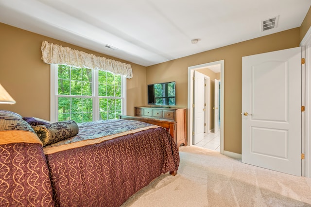 bedroom featuring light carpet