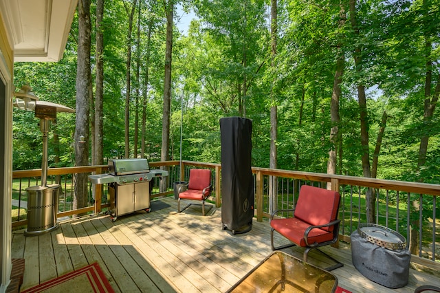 wooden deck featuring area for grilling