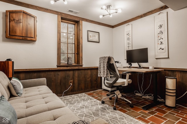 home office with a notable chandelier and wood walls