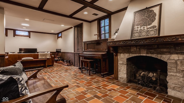 living room featuring wooden walls, a fireplace, and a wealth of natural light