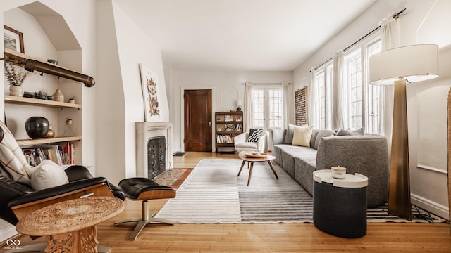 living area with light hardwood / wood-style flooring