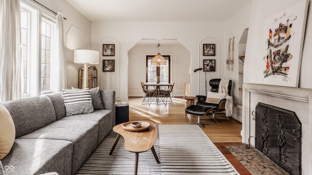 living room featuring dark hardwood / wood-style flooring and plenty of natural light