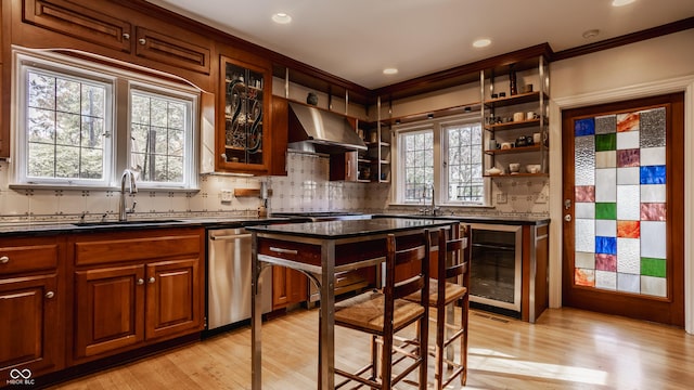 kitchen with sink, wine cooler, light hardwood / wood-style flooring, stainless steel dishwasher, and range hood