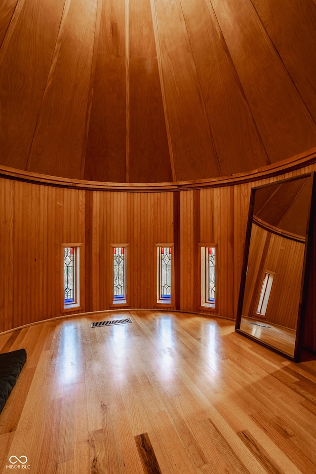 bonus room with hardwood / wood-style floors