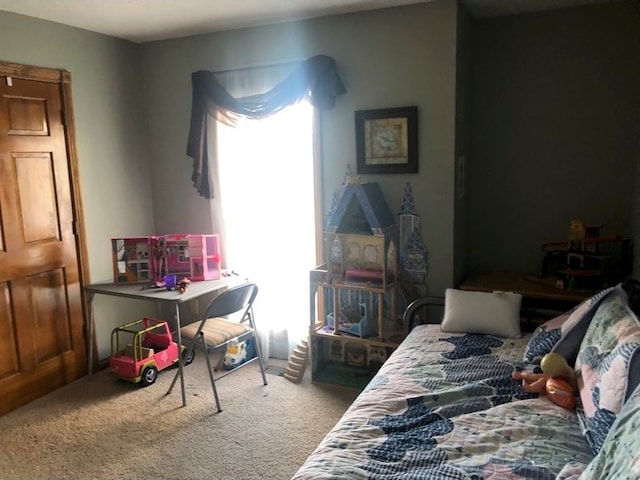 bedroom featuring carpet flooring and multiple windows