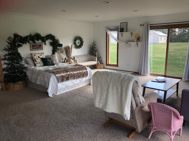 bedroom featuring carpet flooring, access to outside, and multiple windows