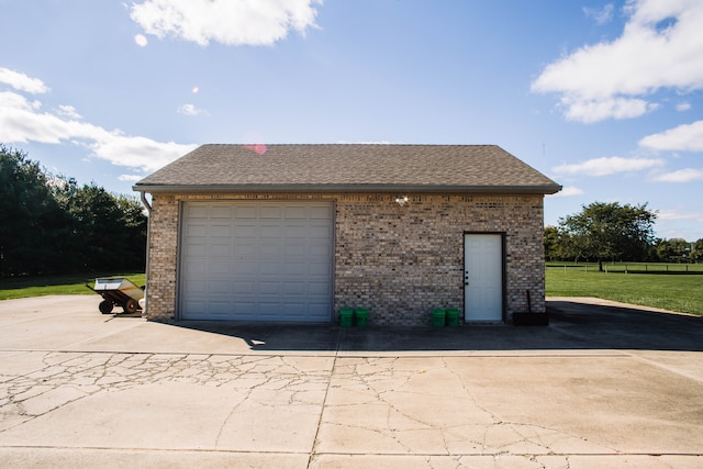 garage with a lawn