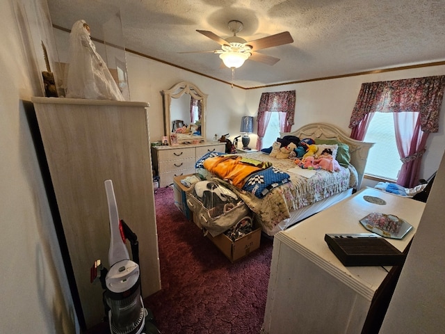 carpeted bedroom with a textured ceiling and ceiling fan