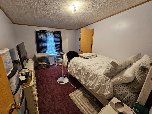 bedroom featuring carpet and a textured ceiling