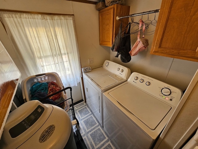 washroom with cabinets, independent washer and dryer, and tile floors