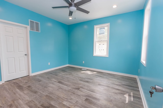 interior space with dark hardwood / wood-style floors and ceiling fan